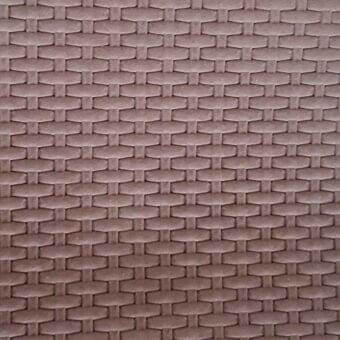 Nubuk leather rug, muted taupe, repeating hexagonal pattern; digitally printed texture with subtle tonal variations and a soft, velvety finish.